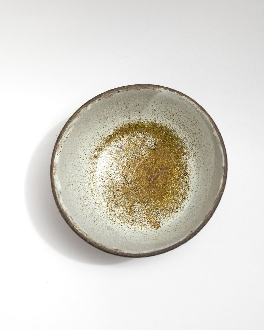 Ceramic bowl with a textured surface on a white background