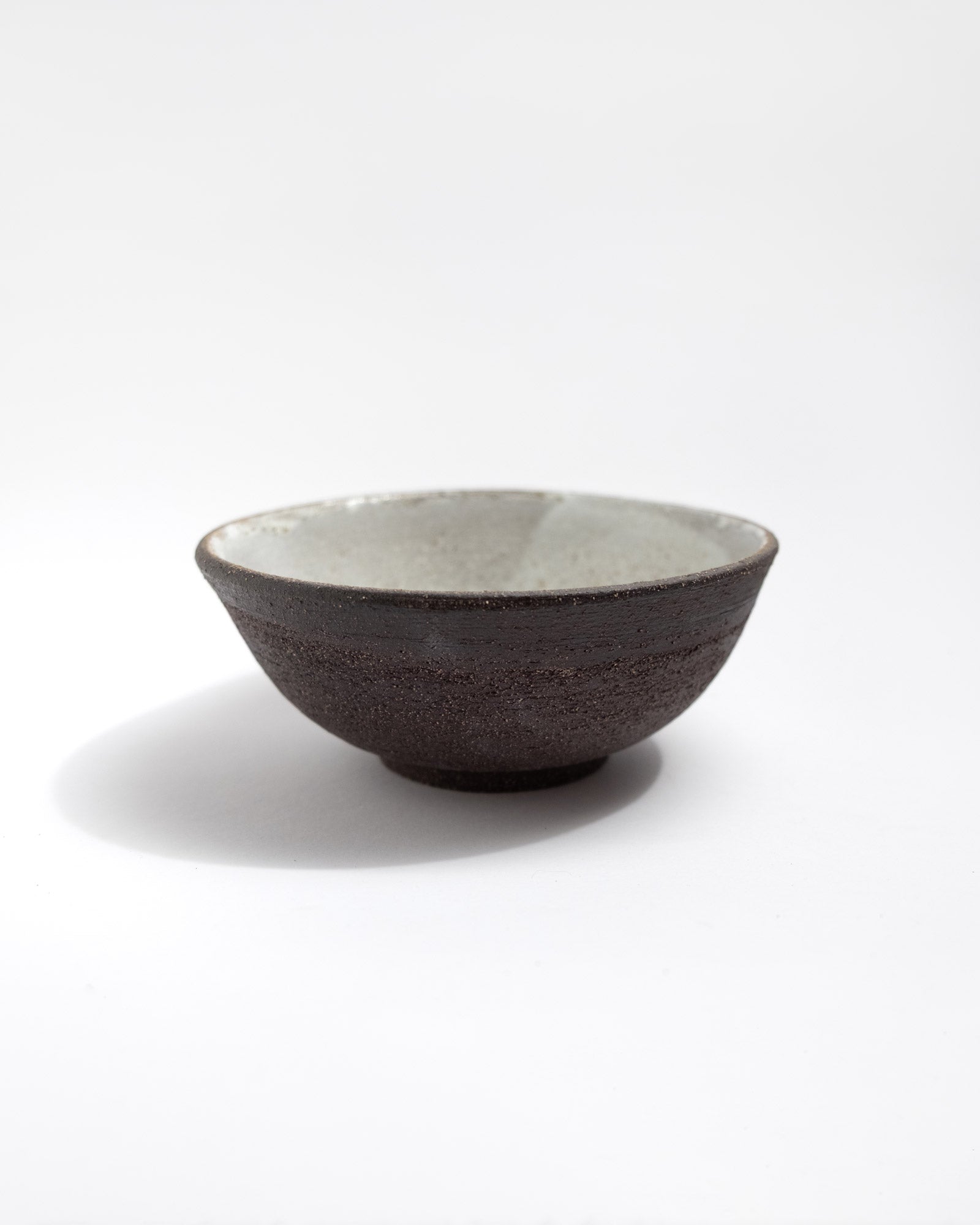 Ceramic handmade bowl with a black textured surface