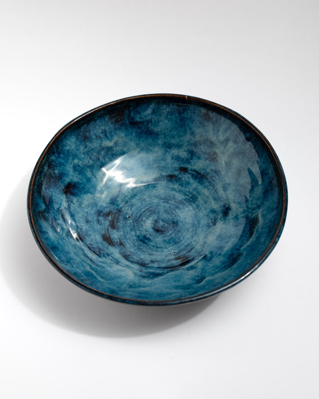 Blue ceramic bowl with swirling pattern, handmade in Italy, centerpiece
