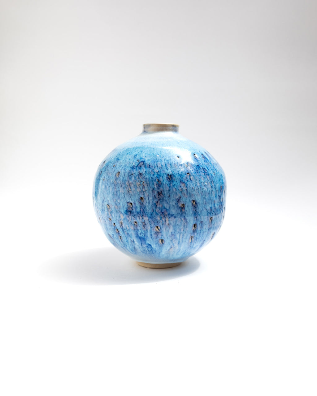 Blue ceramic vase on a white background
