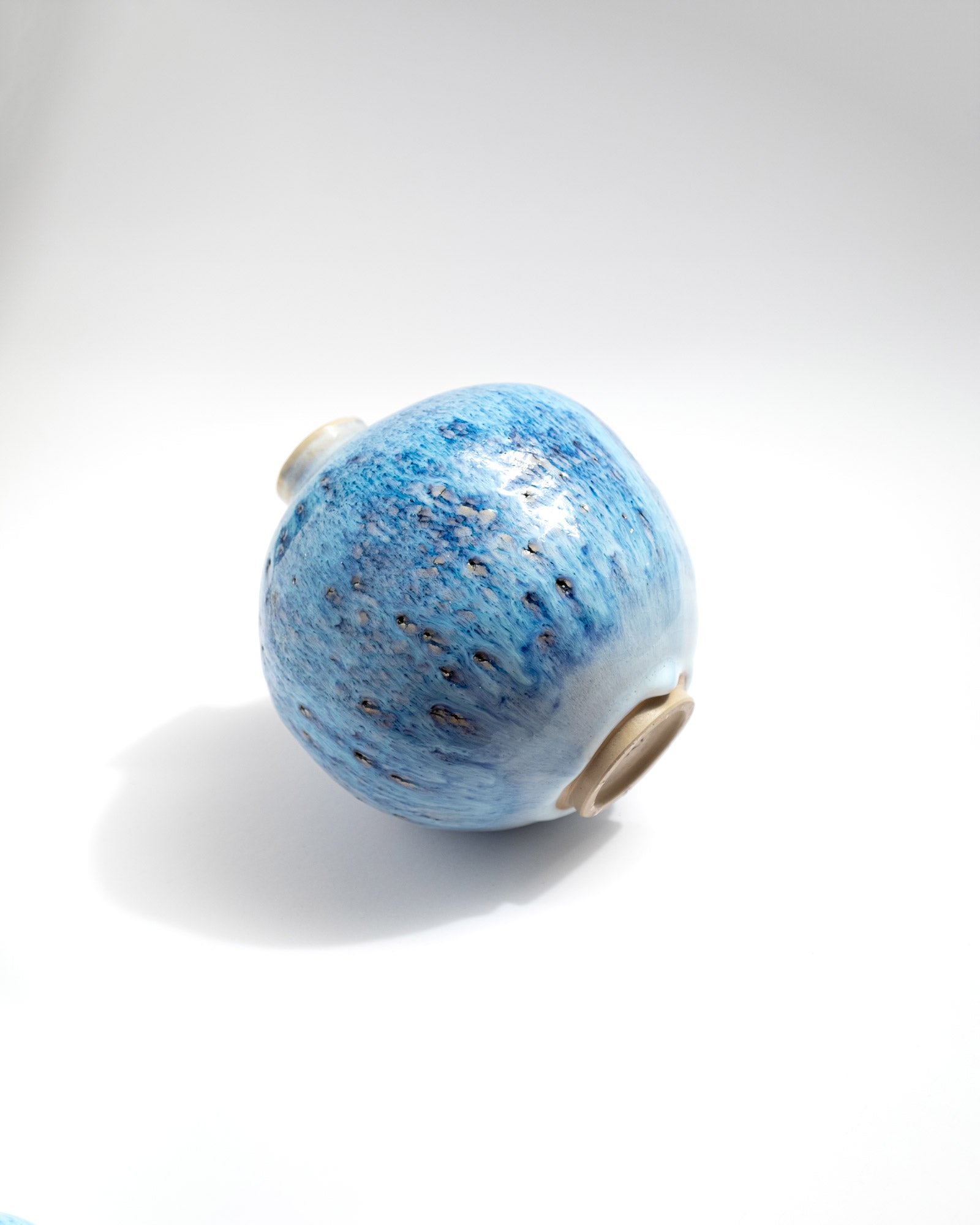Blue ceramic vessel on a white background