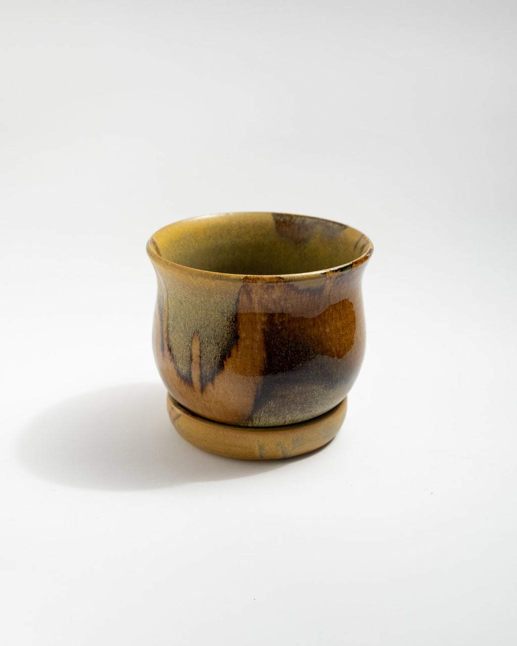 Brown ceramic planter on a white background