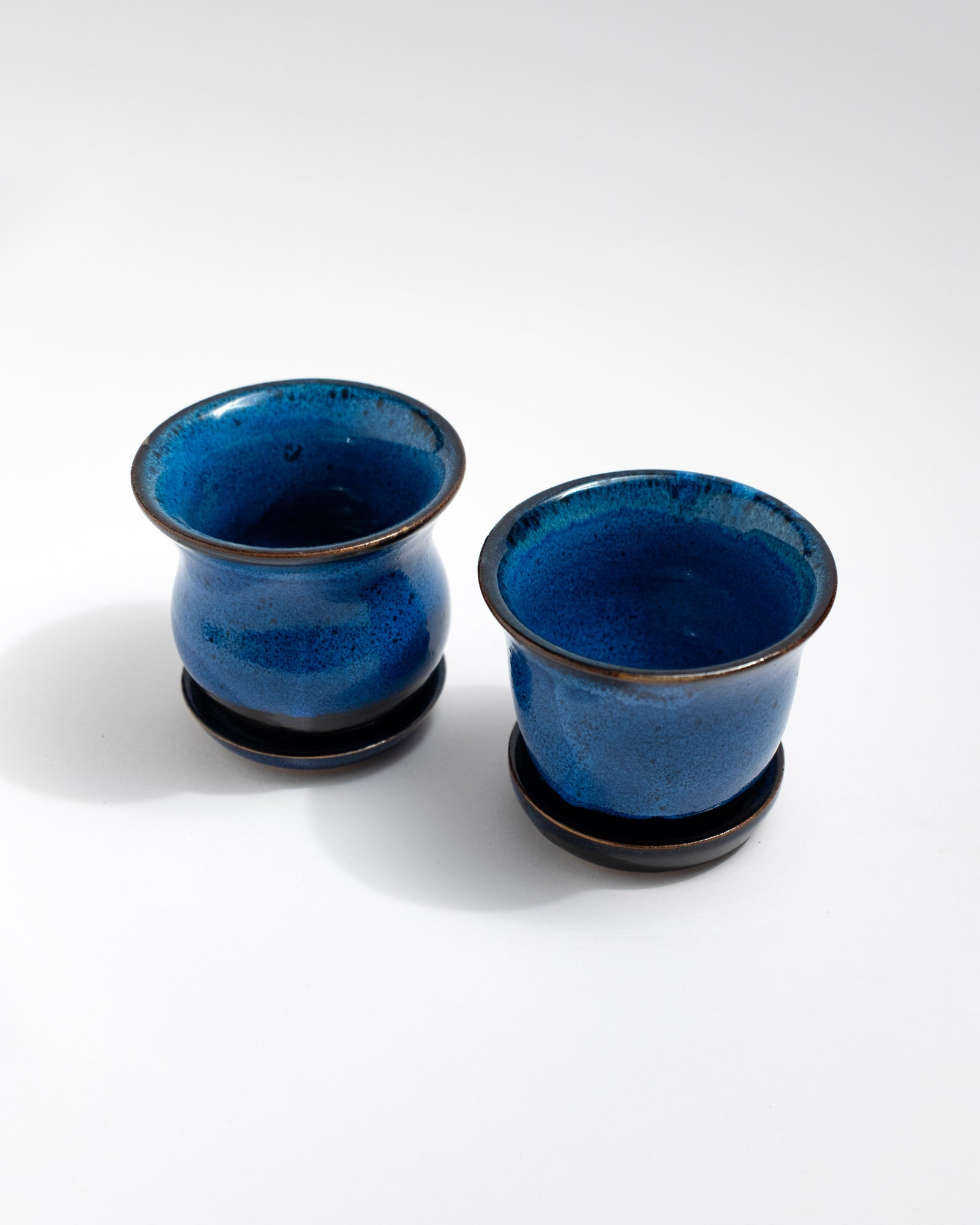 Small handmade cobalt-blue ceramics planter with matching saucer