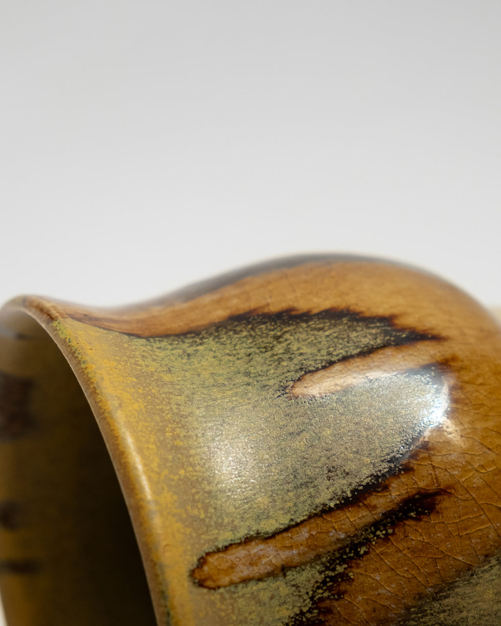 Closeup on a gold glaze planter handmade in italy