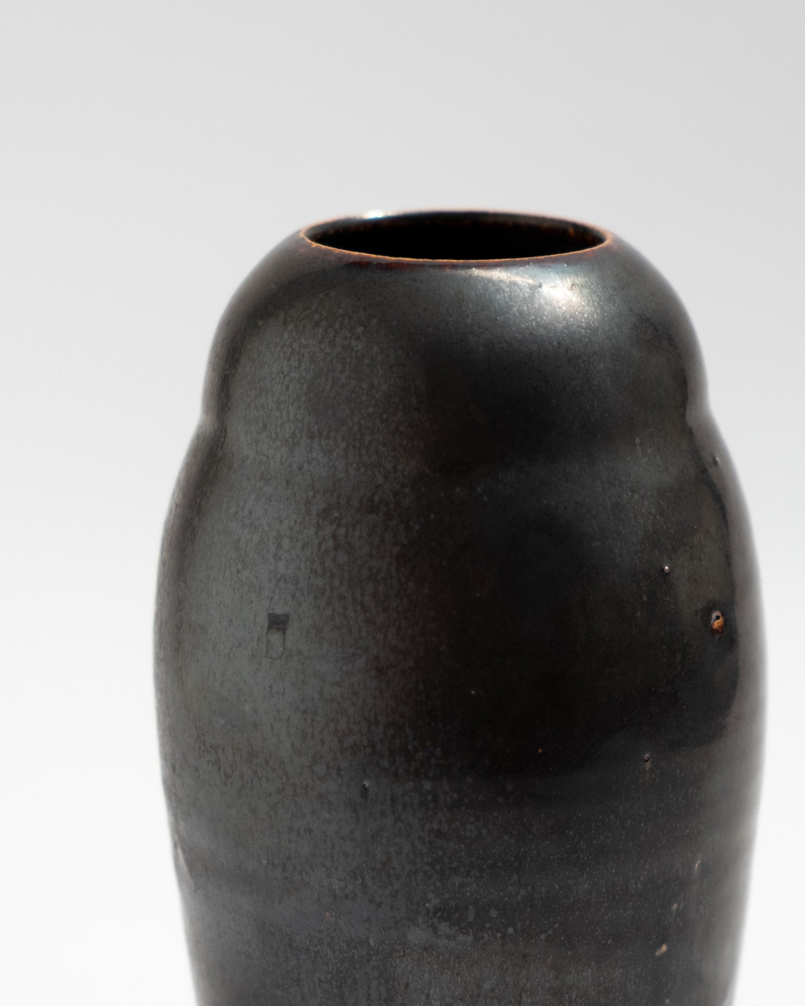 Tiny black vase