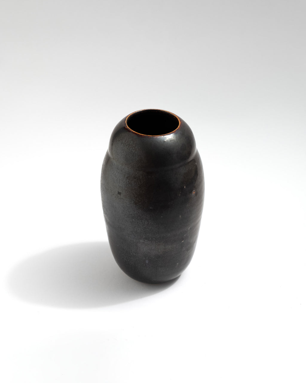 Tiny black vase