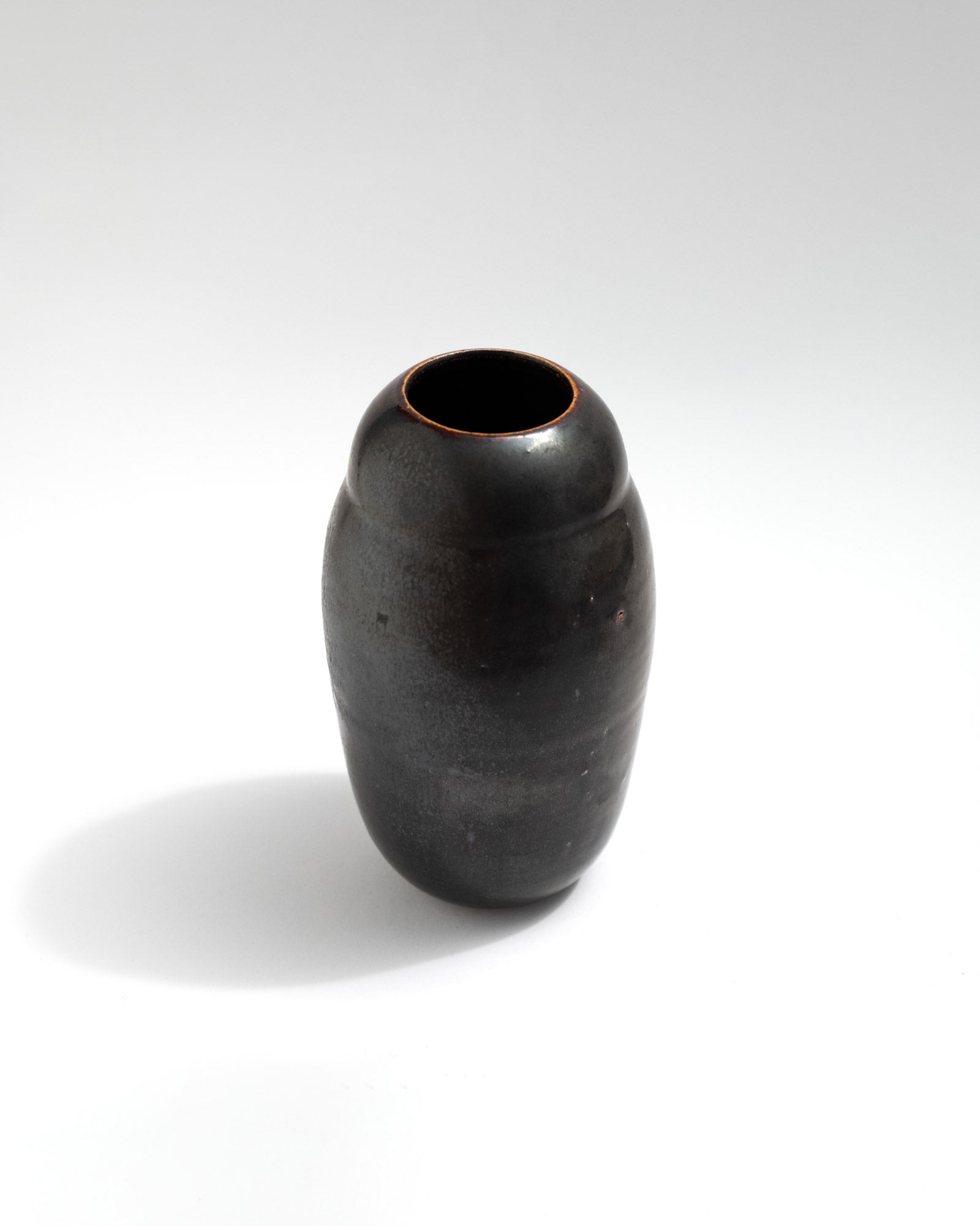 Tiny black vase