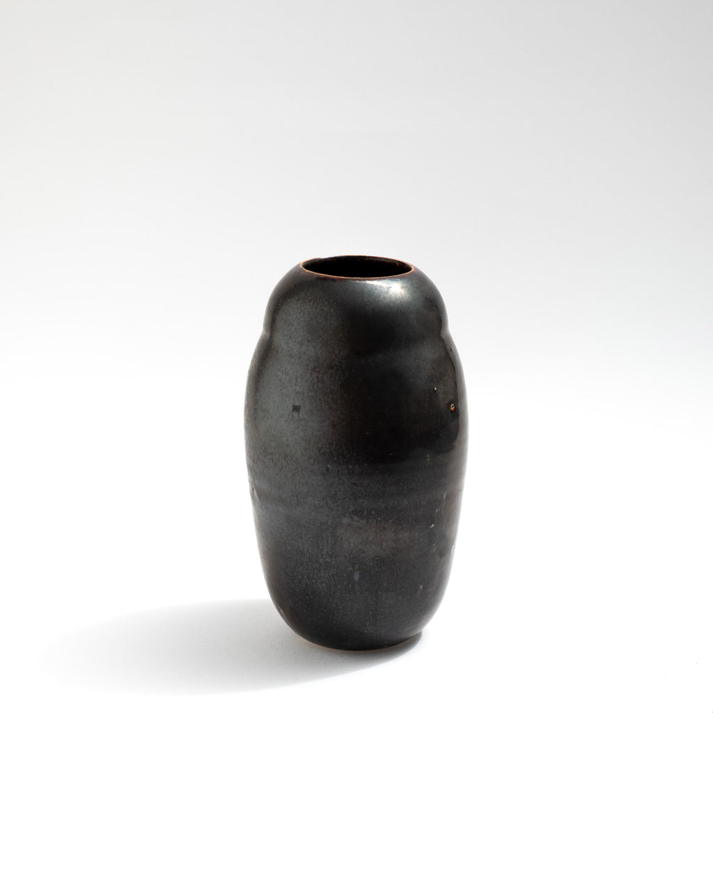 Tiny black vase