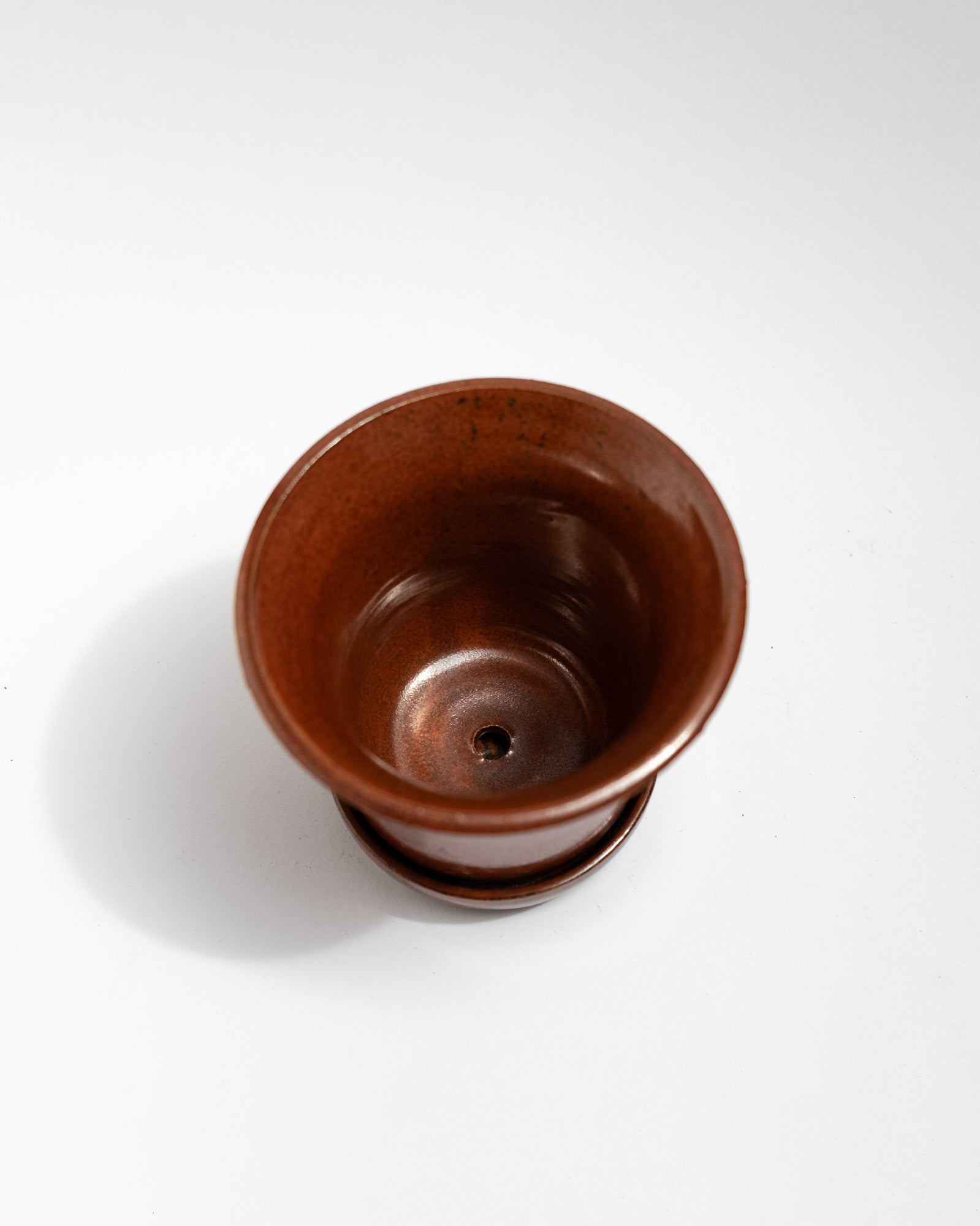 Handmade wheel-thrown stoneware planter with a glossy chestnut-brown glaze