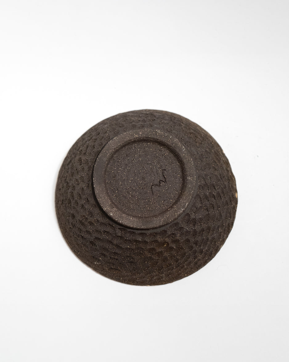 Handmade textured bowl on a white background, made in Italy