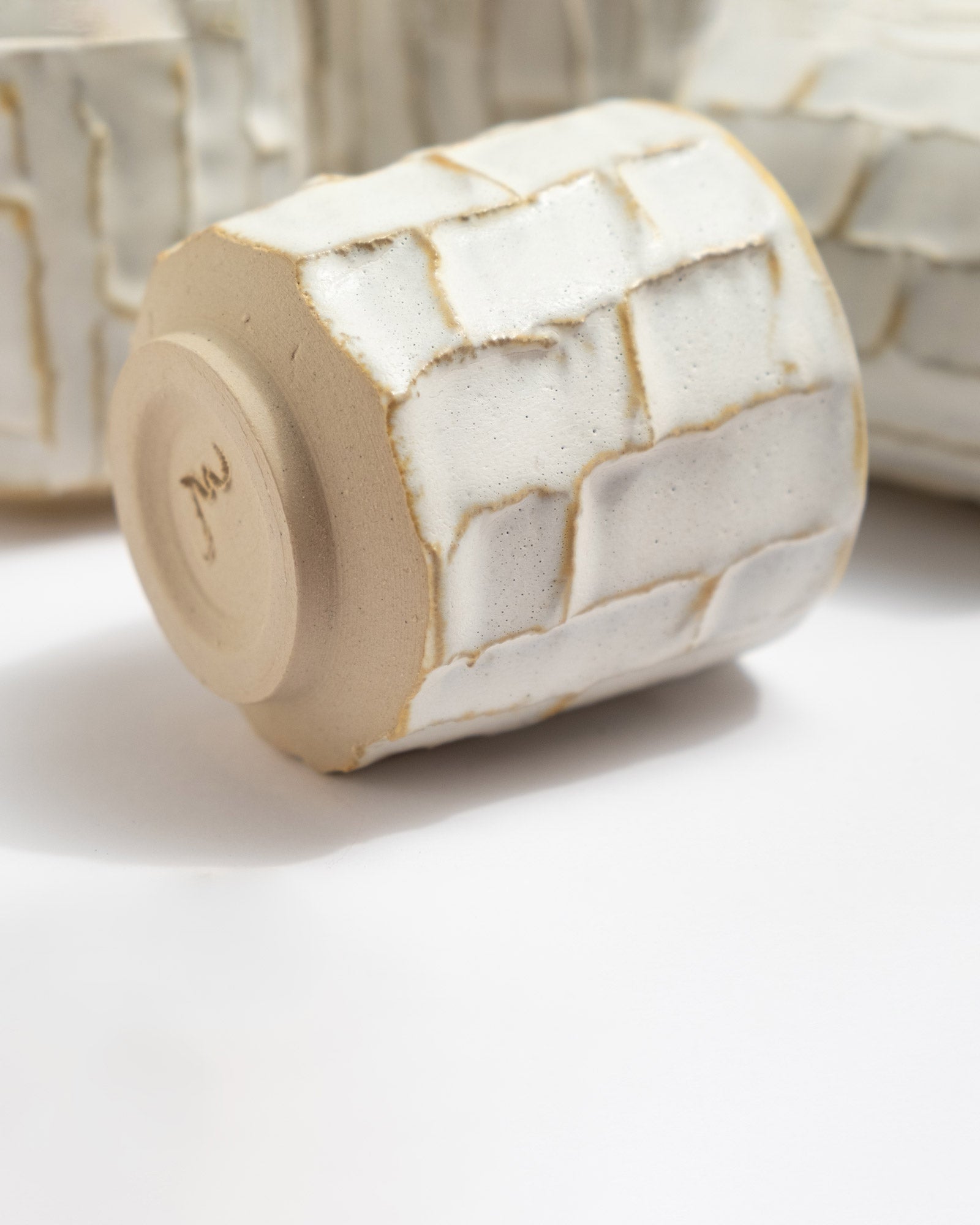 Closeup on handmade white ceramic cup