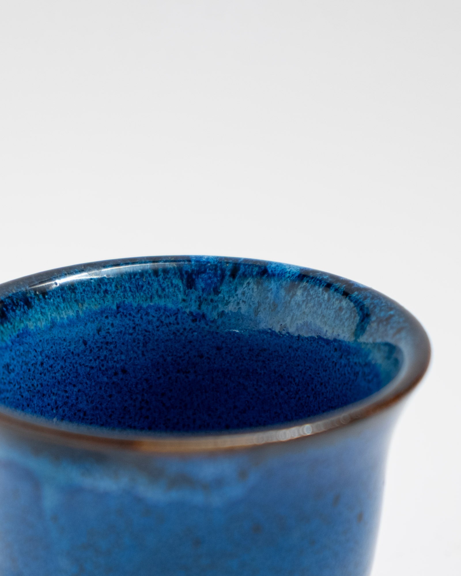 Small handmade cobalt-blue stoneware planter with matching saucer
