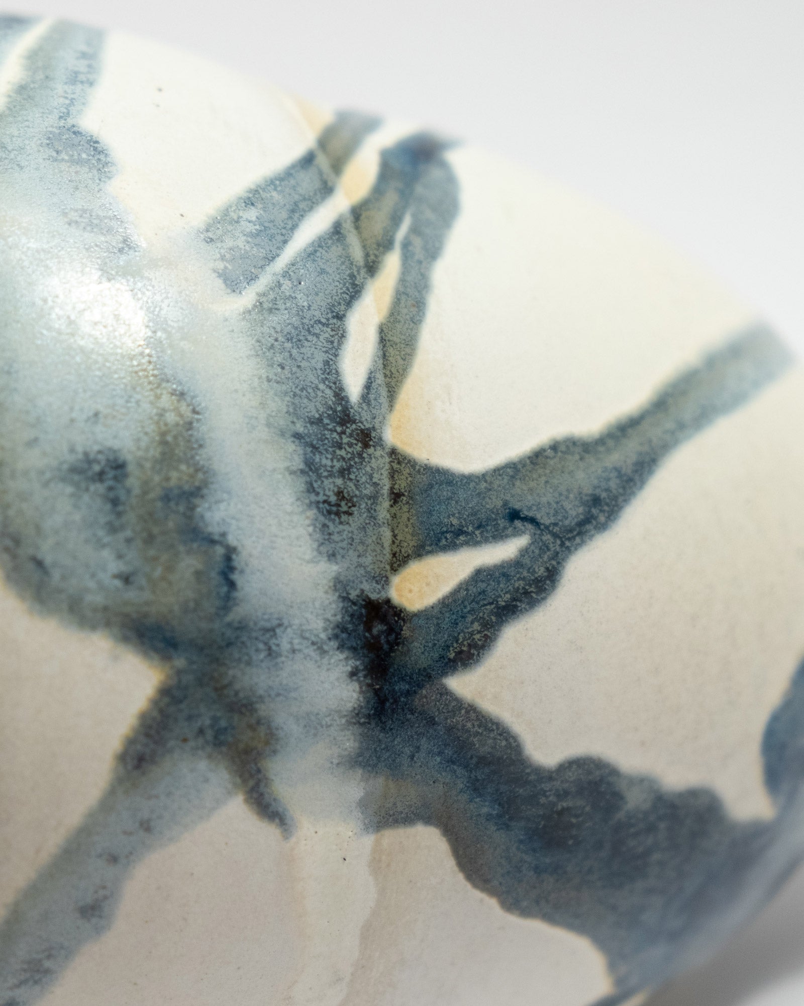 Abstract blue and white pattern on a ceramic handmade vase