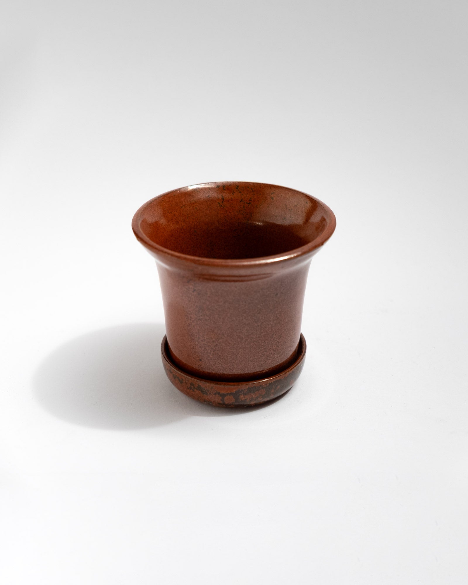 Handmade brown stoneware planter with matching saucer and glossy chestnut glaze