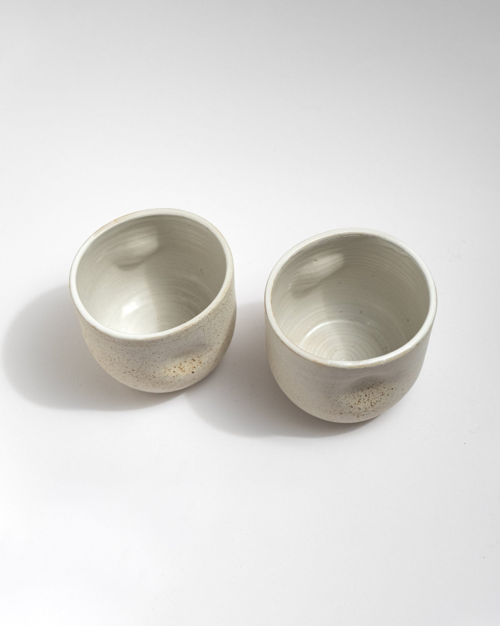 Two ceramic bowls on a white background
