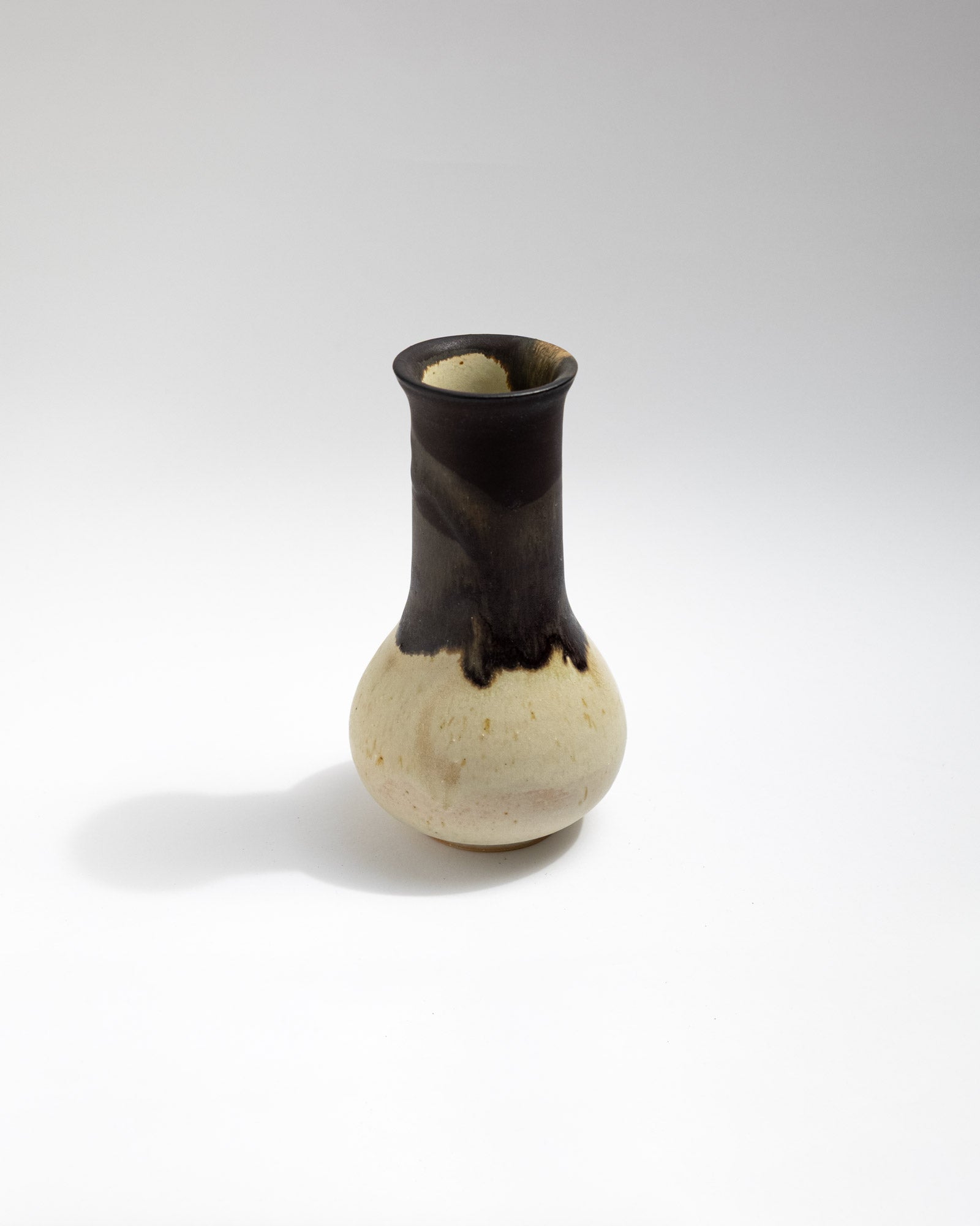 Stoneware vase with charcoal-black glaze and natural dripping transitions, handmade in Italy