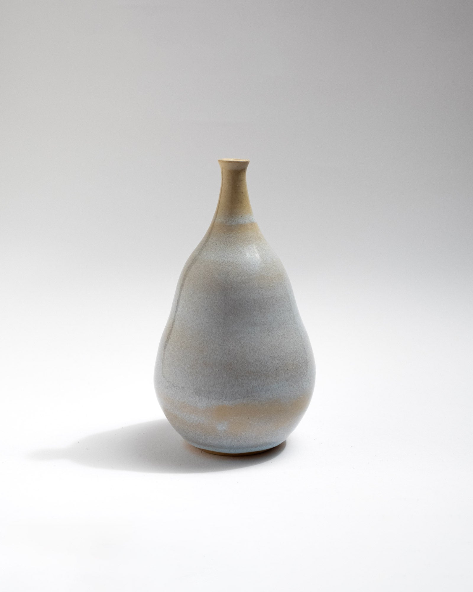 Handmade pear-shaped stoneware vase with soft grey and beige gradient glaze
