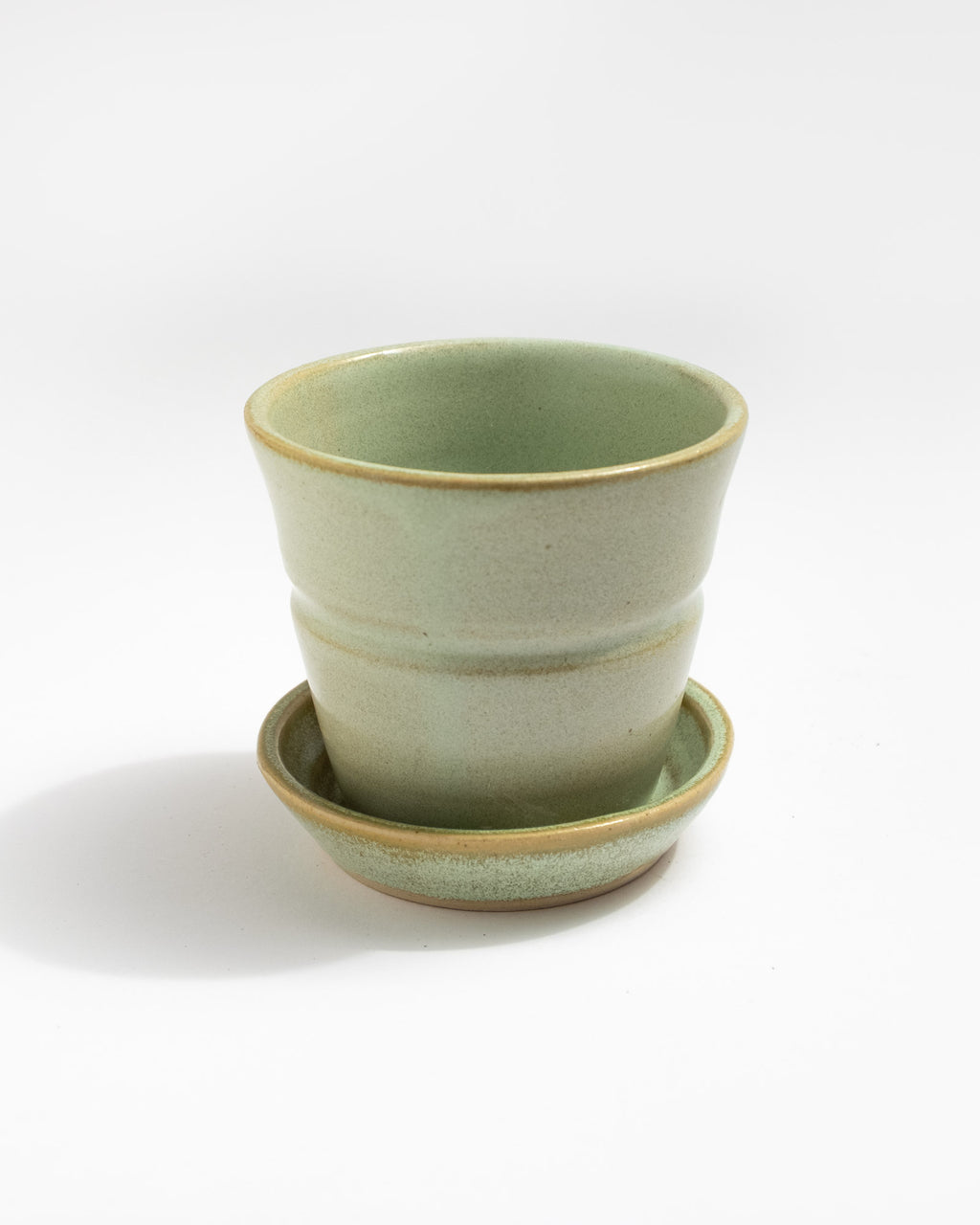 Green ceramic planter with matching saucer, handmade in Italy
