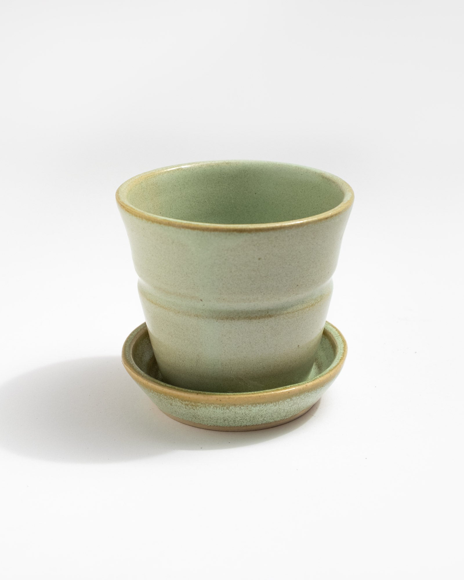 Green ceramic planter with matching saucer, handmade in Italy