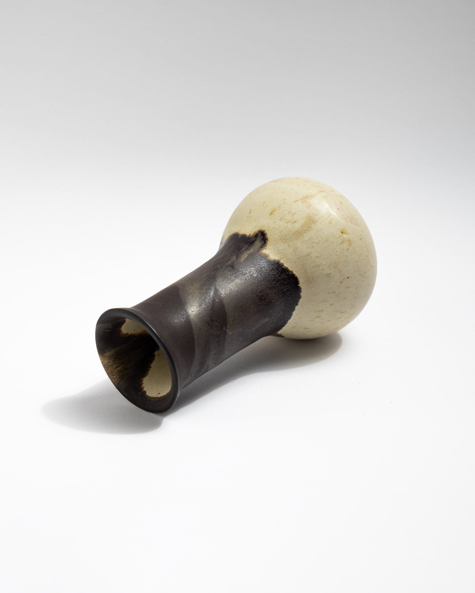 Handmade stoneware vase with charcoal-black glaze and natural dripping transitions