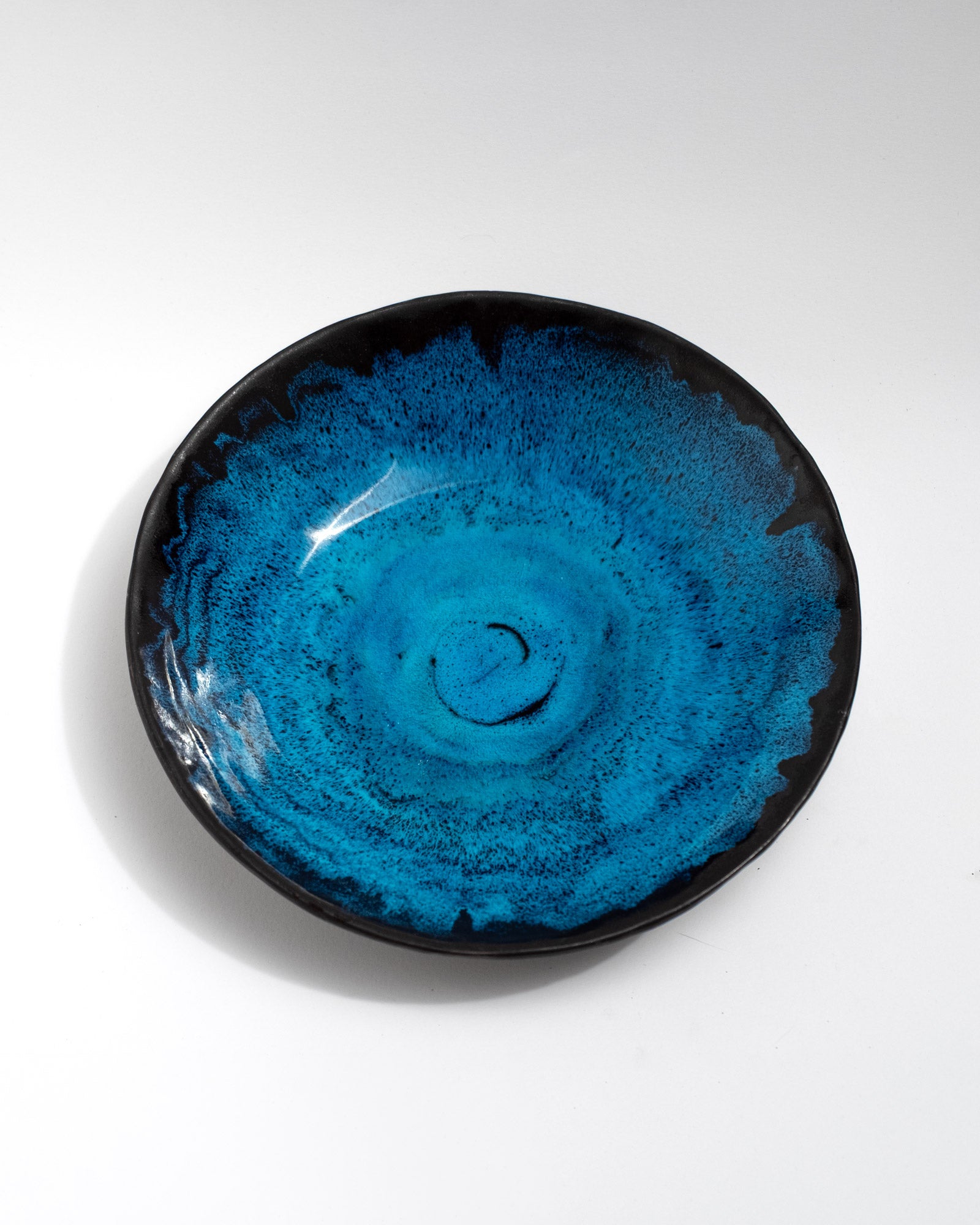 Handmade wheel-thrown stoneware bowl with a glossy turquoise and deep-blue glaze. Artisan ceramics by Malfatto Ceramics, perfect as a serving bowl, centerpiece, or decorative design object.